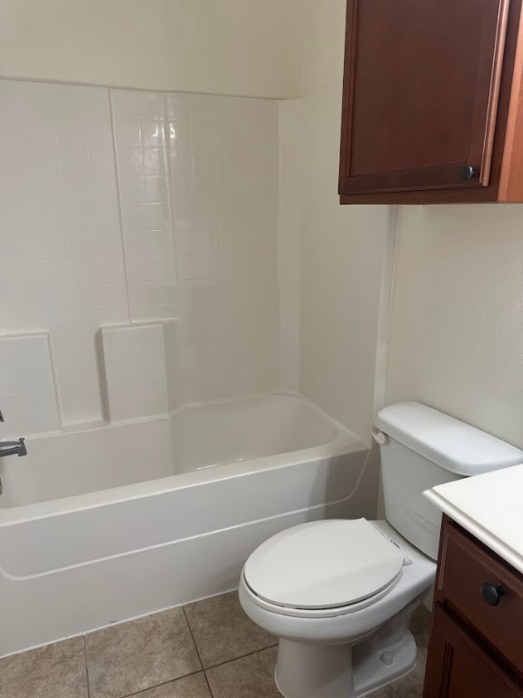 1198 Jones-Butler Road, Unit 1702 College Station, TX 77840 - Photo 15 of 18 a white toilet and tub sitting next to a bathroom sink