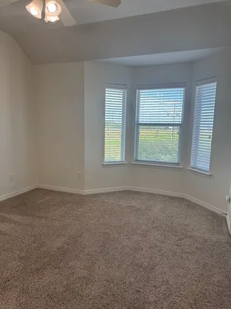 an empty room that has a window