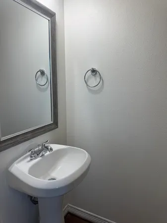 a bathroom with a sink and mirror