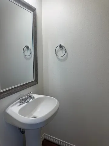 a bathroom with a sink and mirror