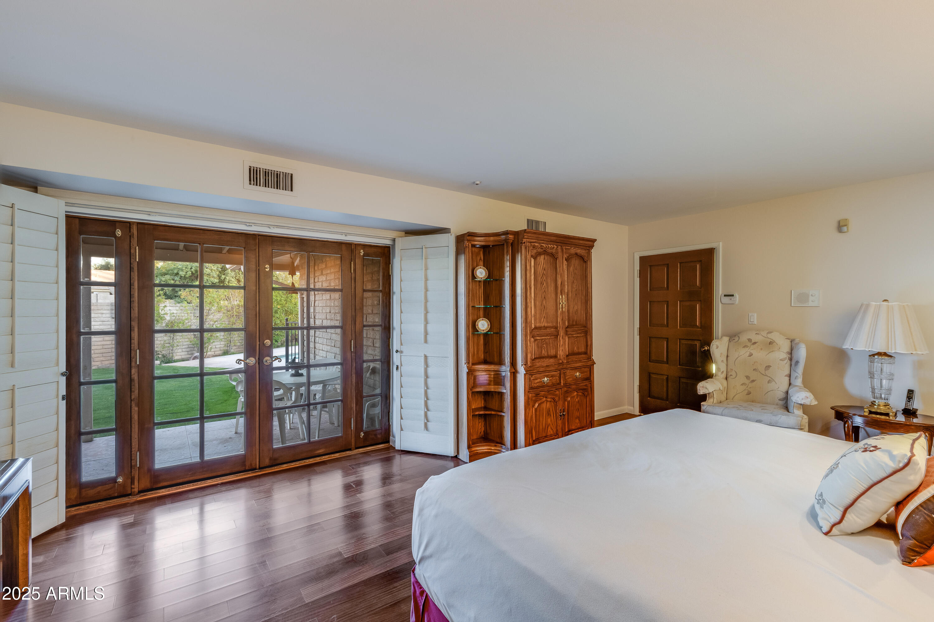 7125 North 2nd Place Phoenix, AZ 85020 - Photo 18 of 30 a bedroom with a large bed and a large window