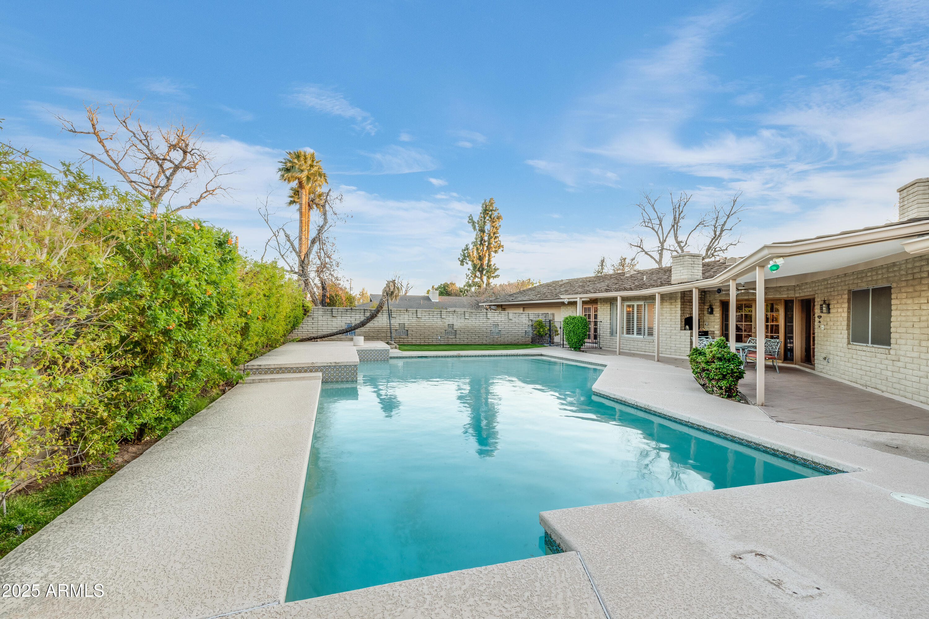 7125 North 2nd Place Phoenix, AZ 85020 - Photo 24 of 30 a view of a swimming pool with a patio