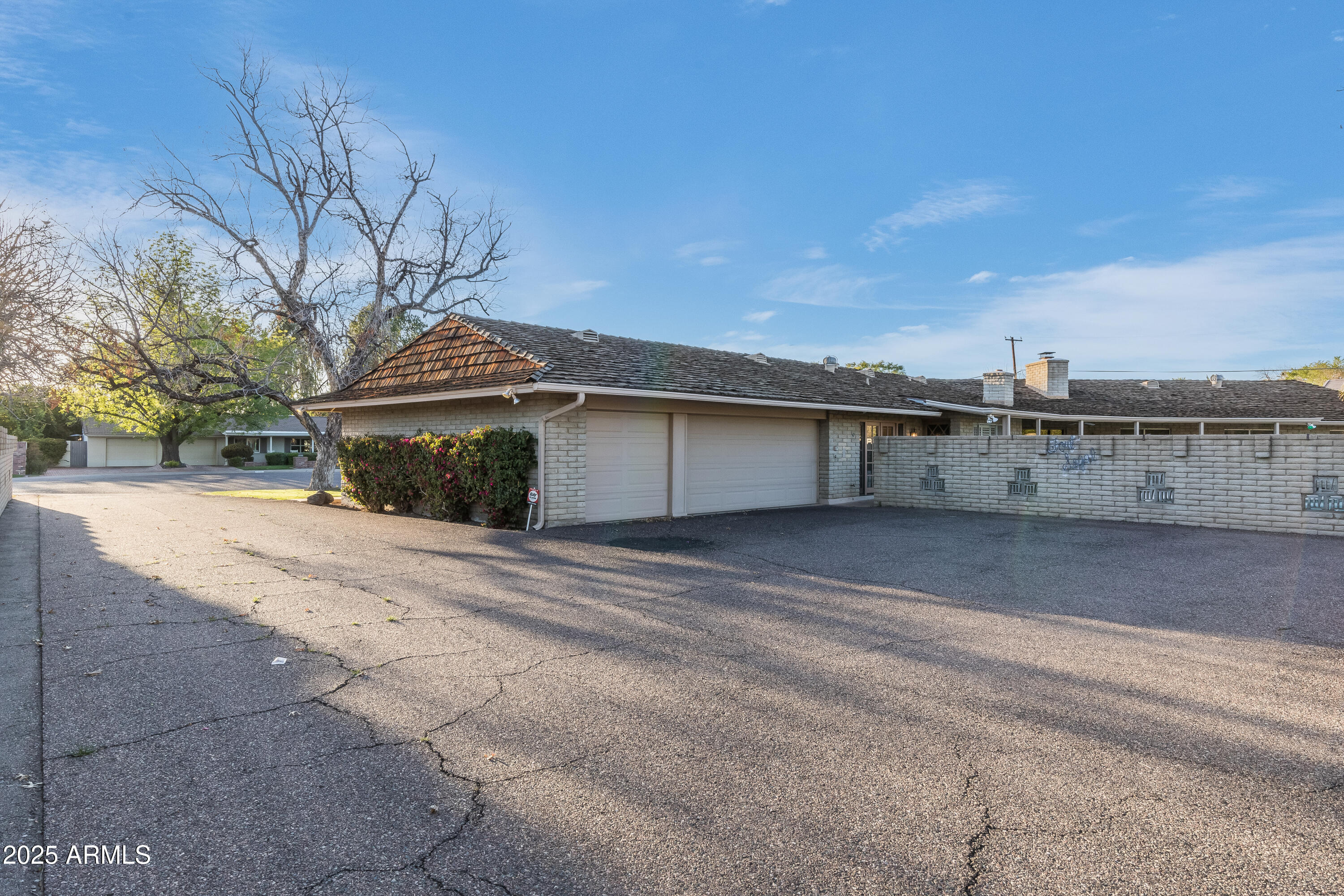 7125 North 2nd Place Phoenix, AZ 85020 - Photo 29 of 30 a view of a house with a yard and garage