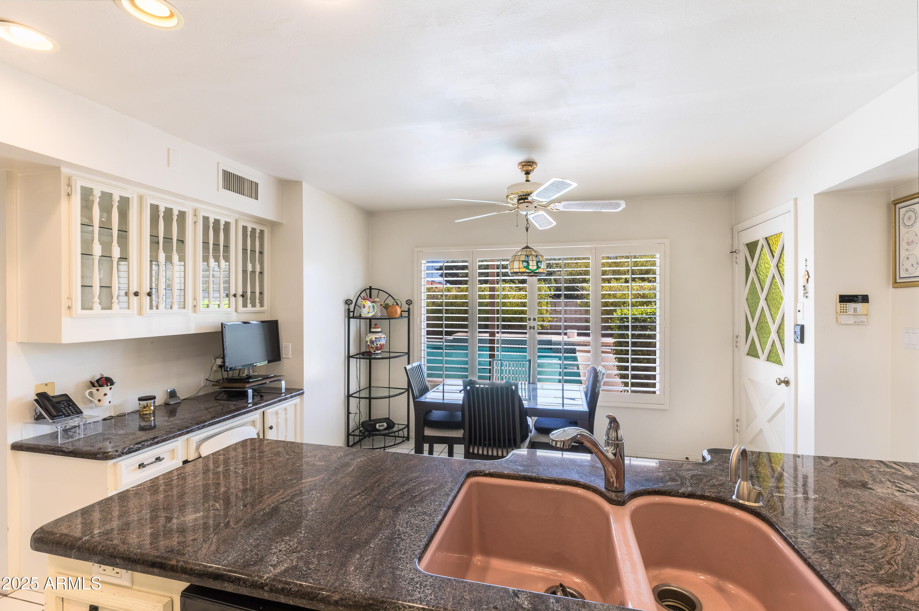 7125 North 2nd Place Phoenix, AZ 85020 - Photo 6 of 30 a living room with furniture large window and flat screen tv