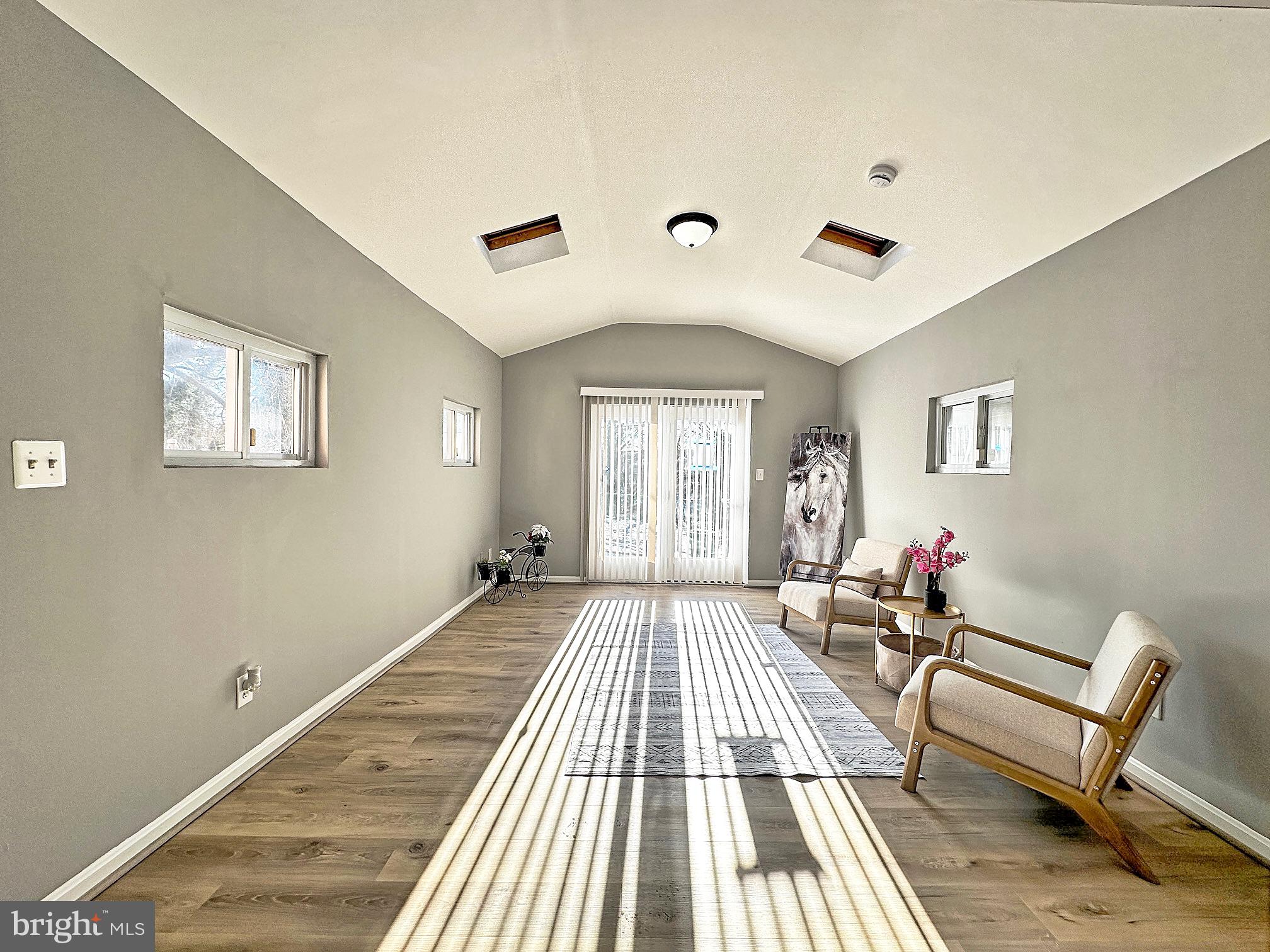 116 Hillvale Road Baltimore, MD 21229 - Photo 11 of 26 a spacious bedroom with a bed and wooden floor