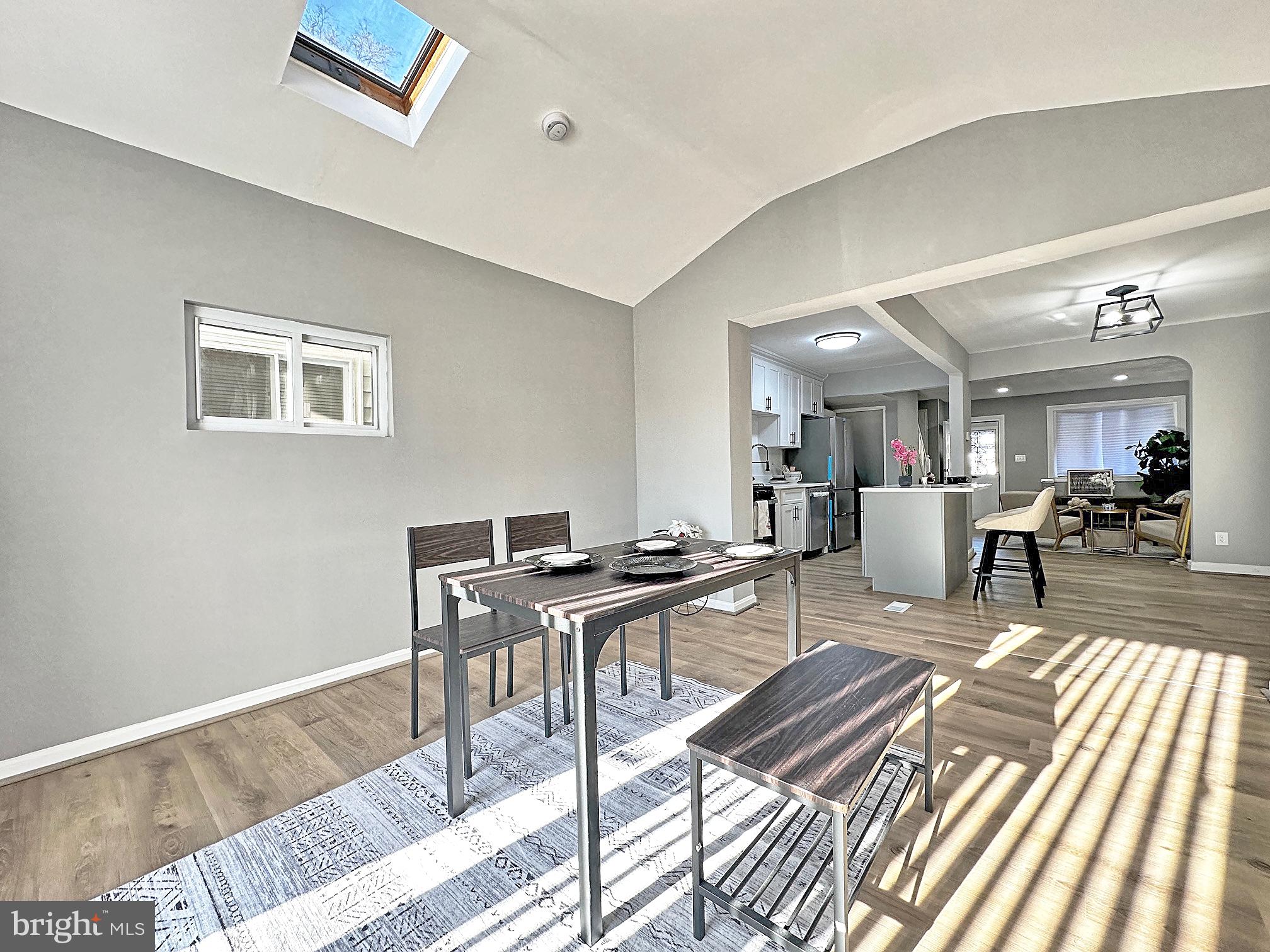 116 Hillvale Road Baltimore, MD 21229 - Photo 12 of 26 a living room with furniture a rug and a window