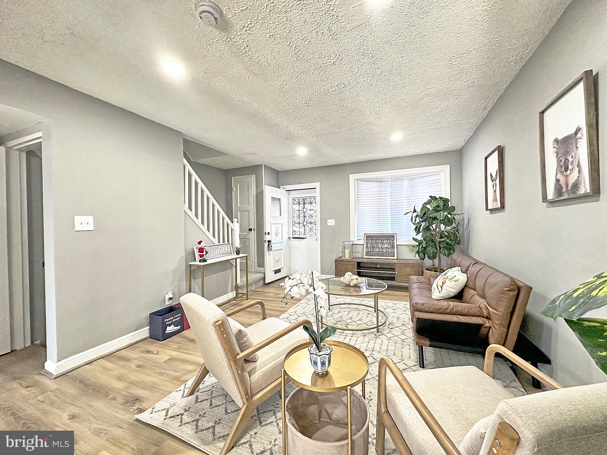 116 Hillvale Road Baltimore, MD 21229 - Photo 3 of 26 a living room with furniture and a wooden floor
