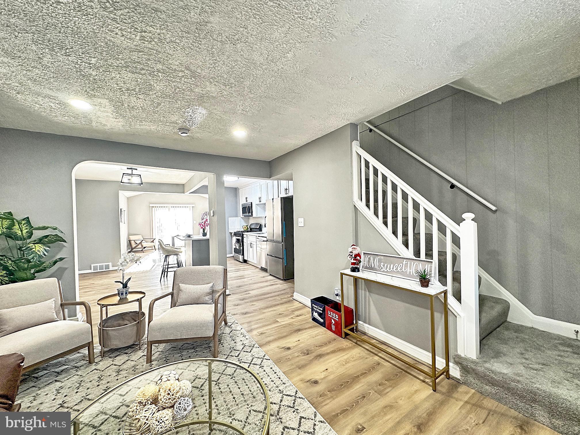 116 Hillvale Road Baltimore, MD 21229 - Photo 4 of 26 a view of a livingroom with furniture and staircase