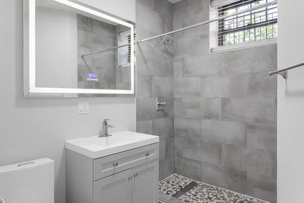 a view of an empty room and fire place