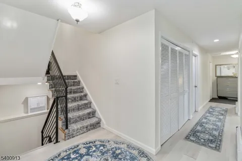 a view of entryway with wooden floor