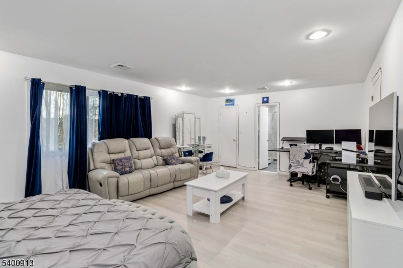 1 Wenonah Avenue Rockaway, NJ 07866 - Photo 18 of 34 a living room with furniture and a large window