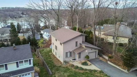 a aerial view of a house with a yard