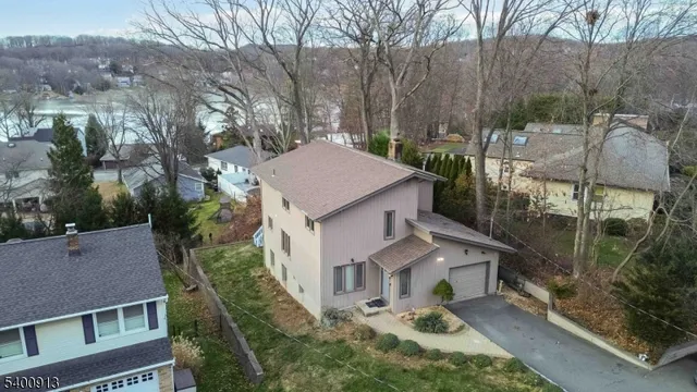 a aerial view of a house with a yard