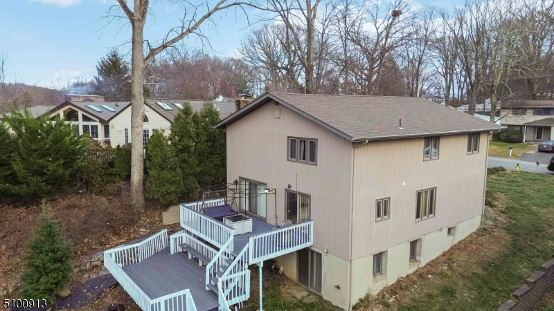 1 Wenonah Avenue Rockaway, NJ 07866 - Photo 6 of 34 a white house covered with tall trees