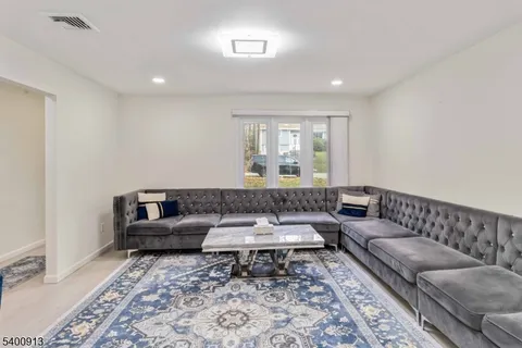 a living room with furniture and a rug