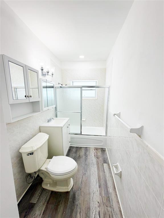 778 Northwest 80th Street Miami, FL 33150 - Photo 17 of 35 a bathroom with a toilet sink and a mirror
