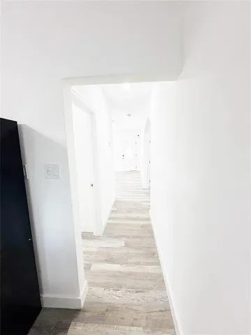 a view of staircase with white walls