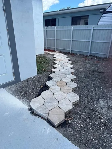 a view of a pathway of a house with wooden floor
