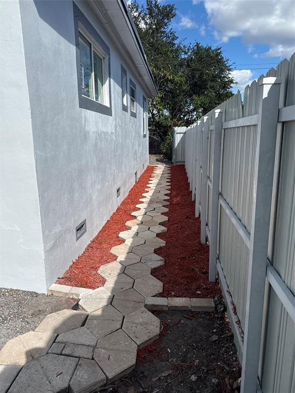 778 Northwest 80th Street Miami, FL 33150 - Photo 31 of 35 a view of a pathway of a house with wooden floor