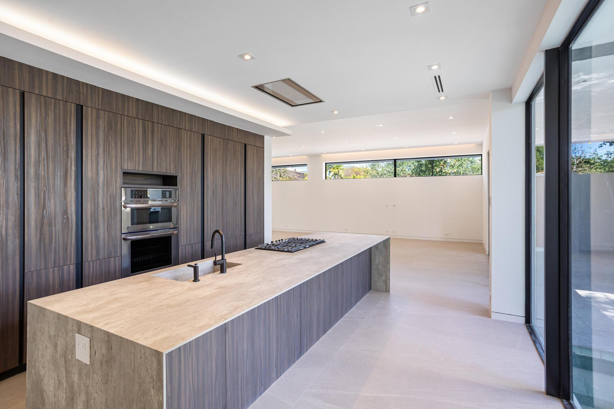 1914 Southwest 22nd Terrace Miami, FL 33145 - Photo 5 of 14 a room with a bed and a large window