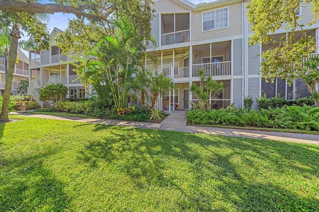 a view of a brick building next to a yard