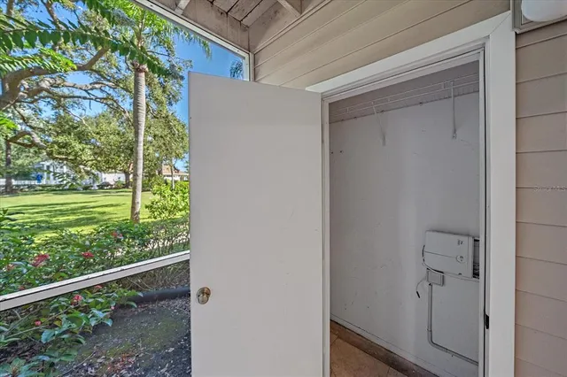 a view of a porch with furniture and garden