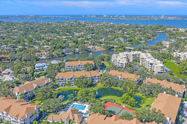 an aerial view of city and lake
