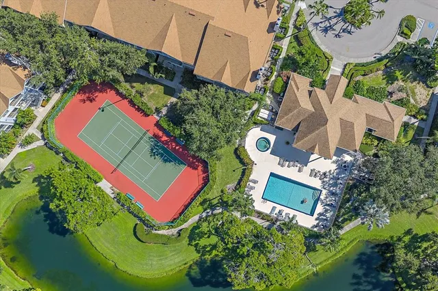 a view of backyard with seating and trees