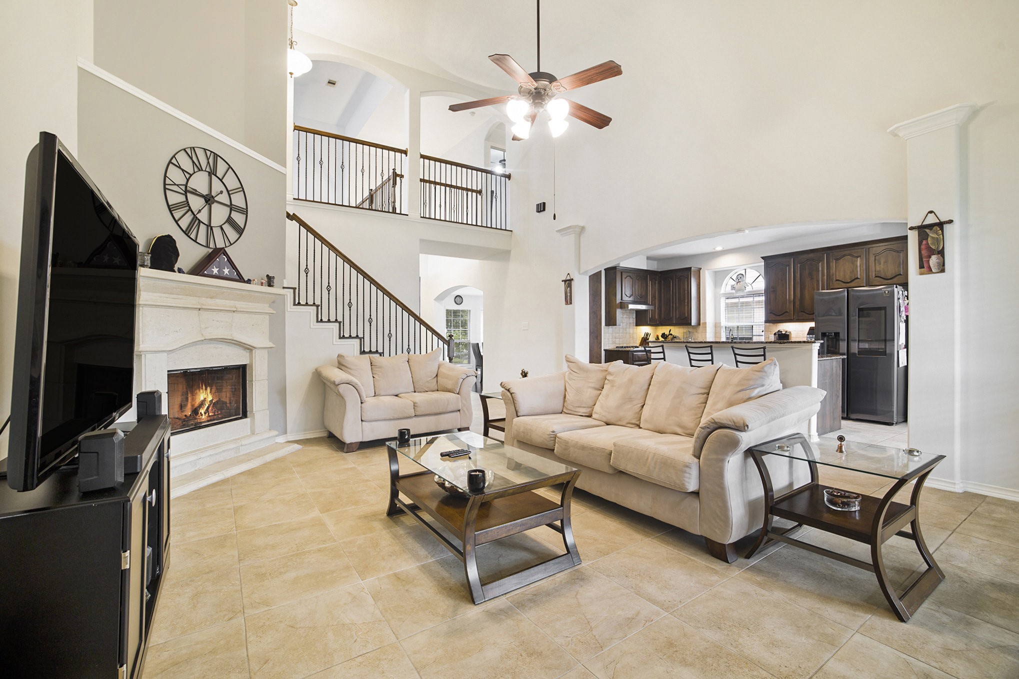 a living room with furniture and a fireplace