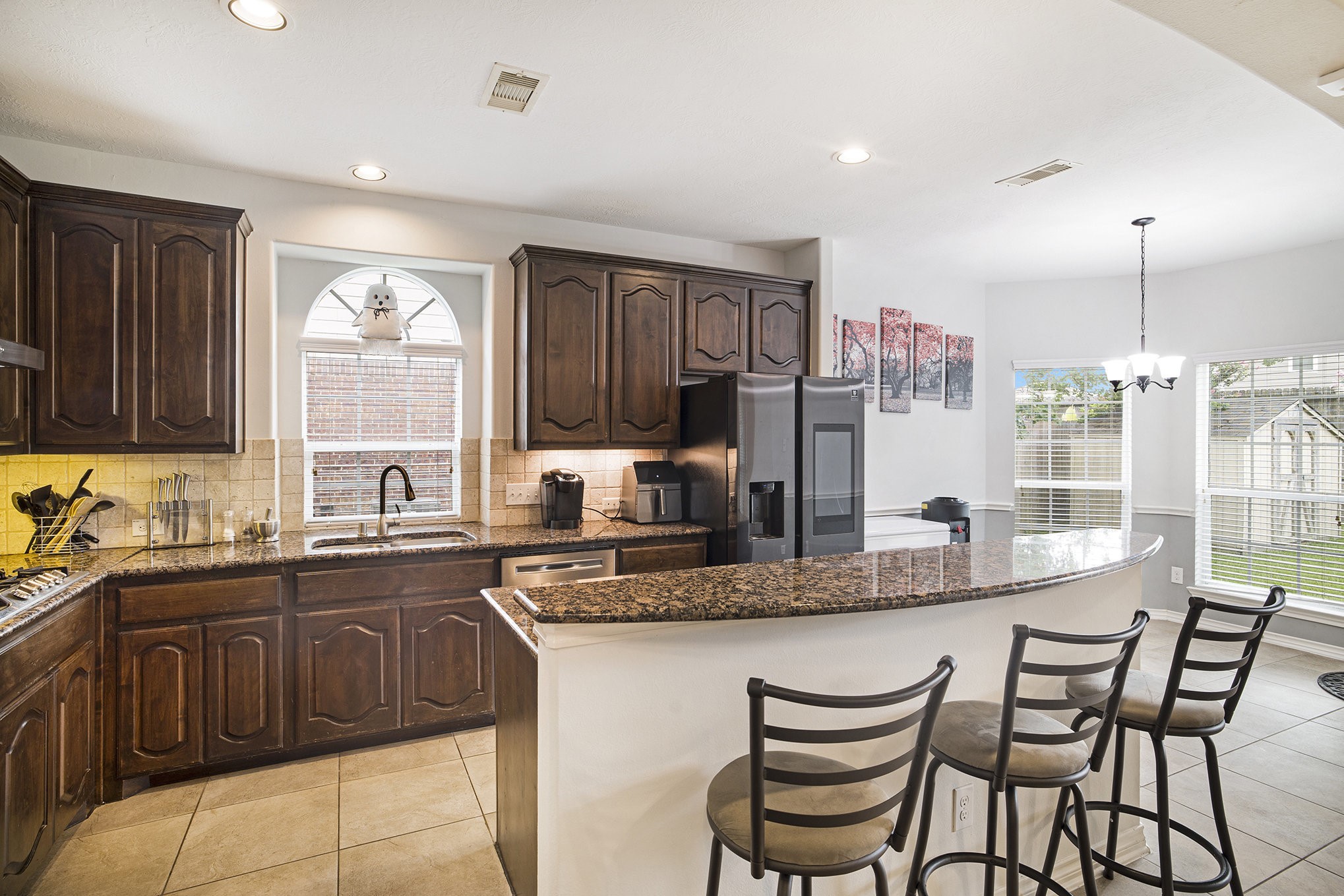 20692 Oakhurst Meadows Drive Porter, TX 77365 - Photo 11 of 37 a kitchen with granite countertop a sink and cabinets