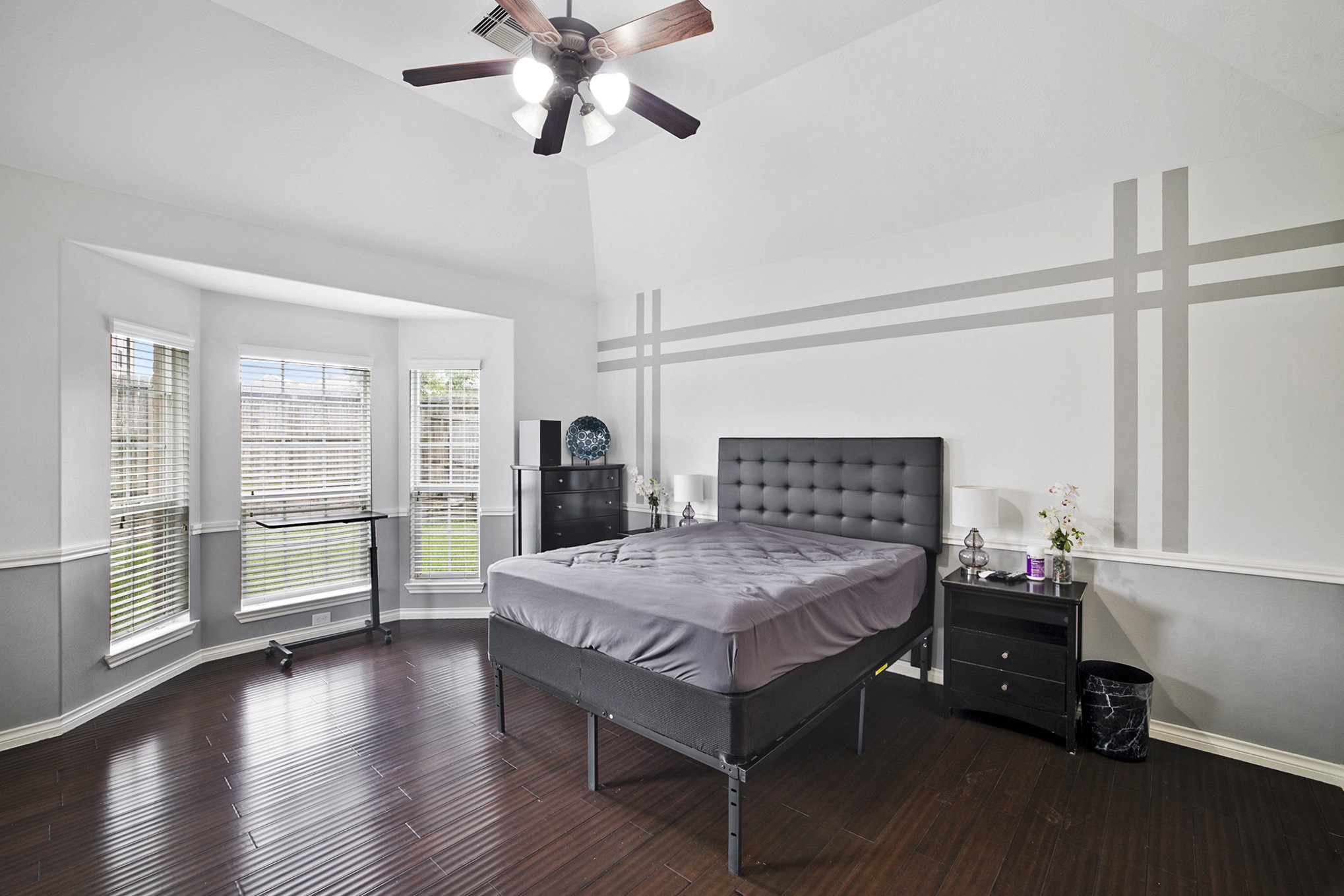 20692 Oakhurst Meadows Drive Porter, TX 77365 - Photo 13 of 37 a bedroom with a bed and wooden floor