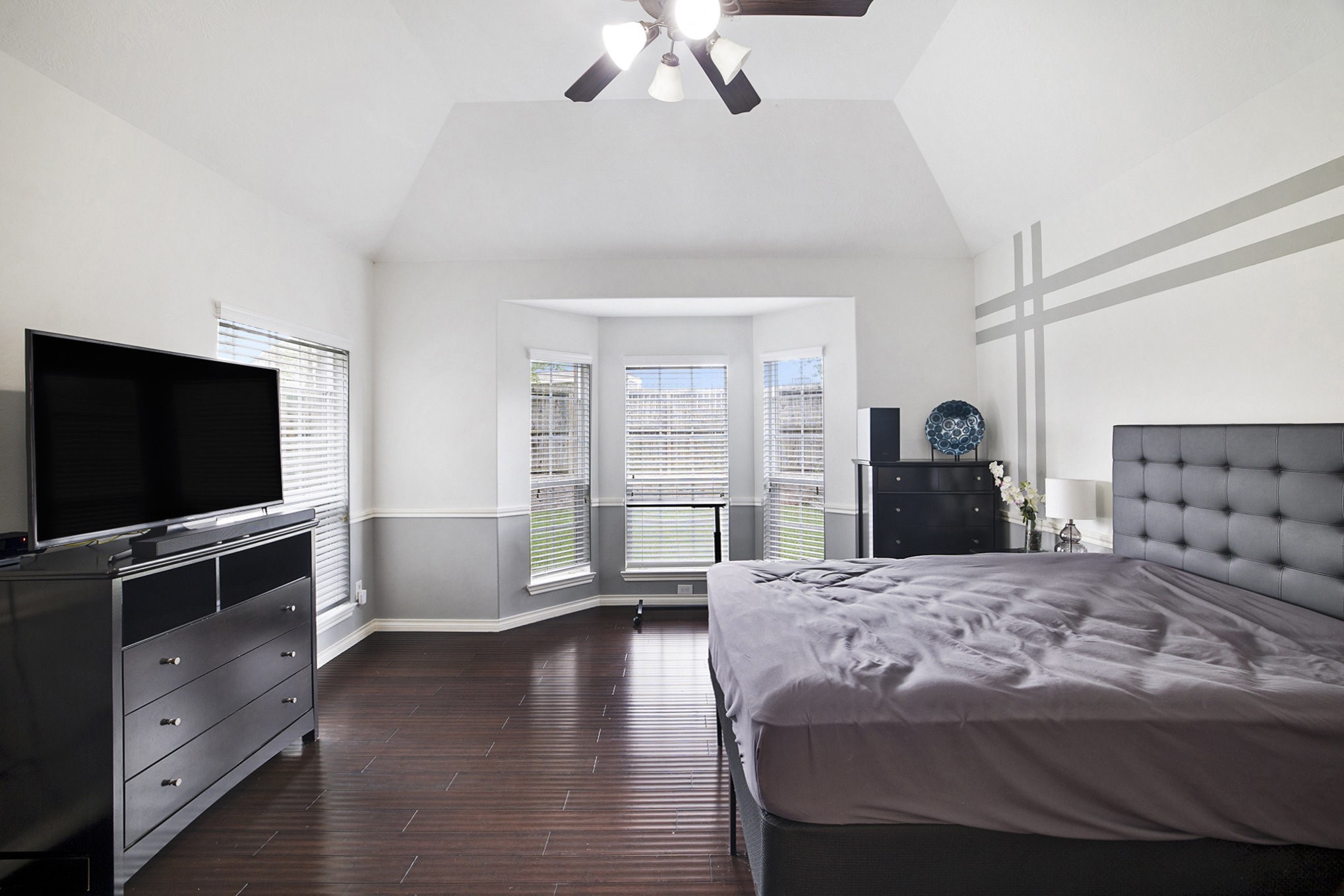 20692 Oakhurst Meadows Drive Porter, TX 77365 - Photo 14 of 37 a bedroom with a large bed and a flat screen tv