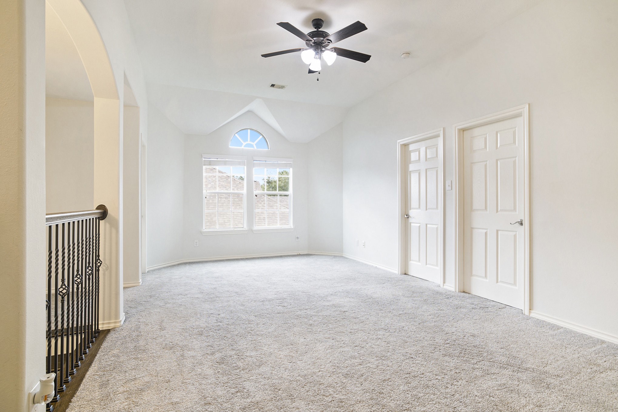 20692 Oakhurst Meadows Drive Porter, TX 77365 - Photo 21 of 37 an empty room with windows and a ceiling fan