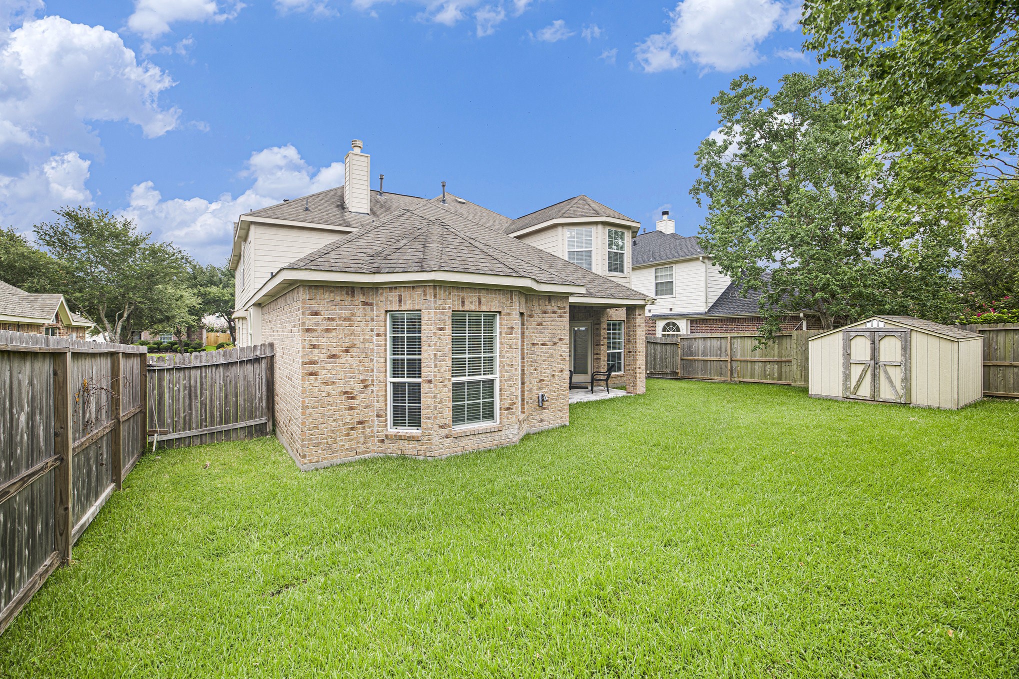 20692 Oakhurst Meadows Drive Porter, TX 77365 - Photo 34 of 37 a view of a house with a yard and sitting area