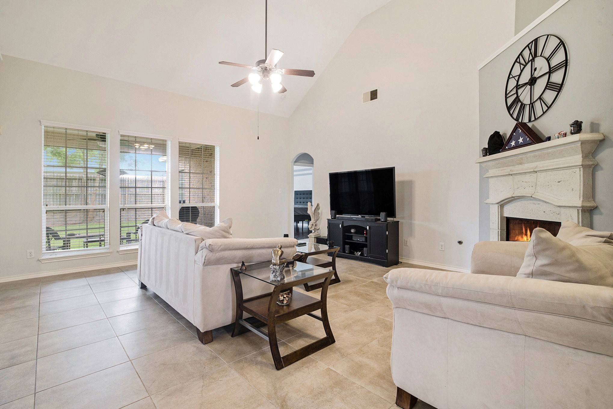 20692 Oakhurst Meadows Drive Porter, TX 77365 - Photo 7 of 37 a living room with furniture a flat screen tv and a fireplace