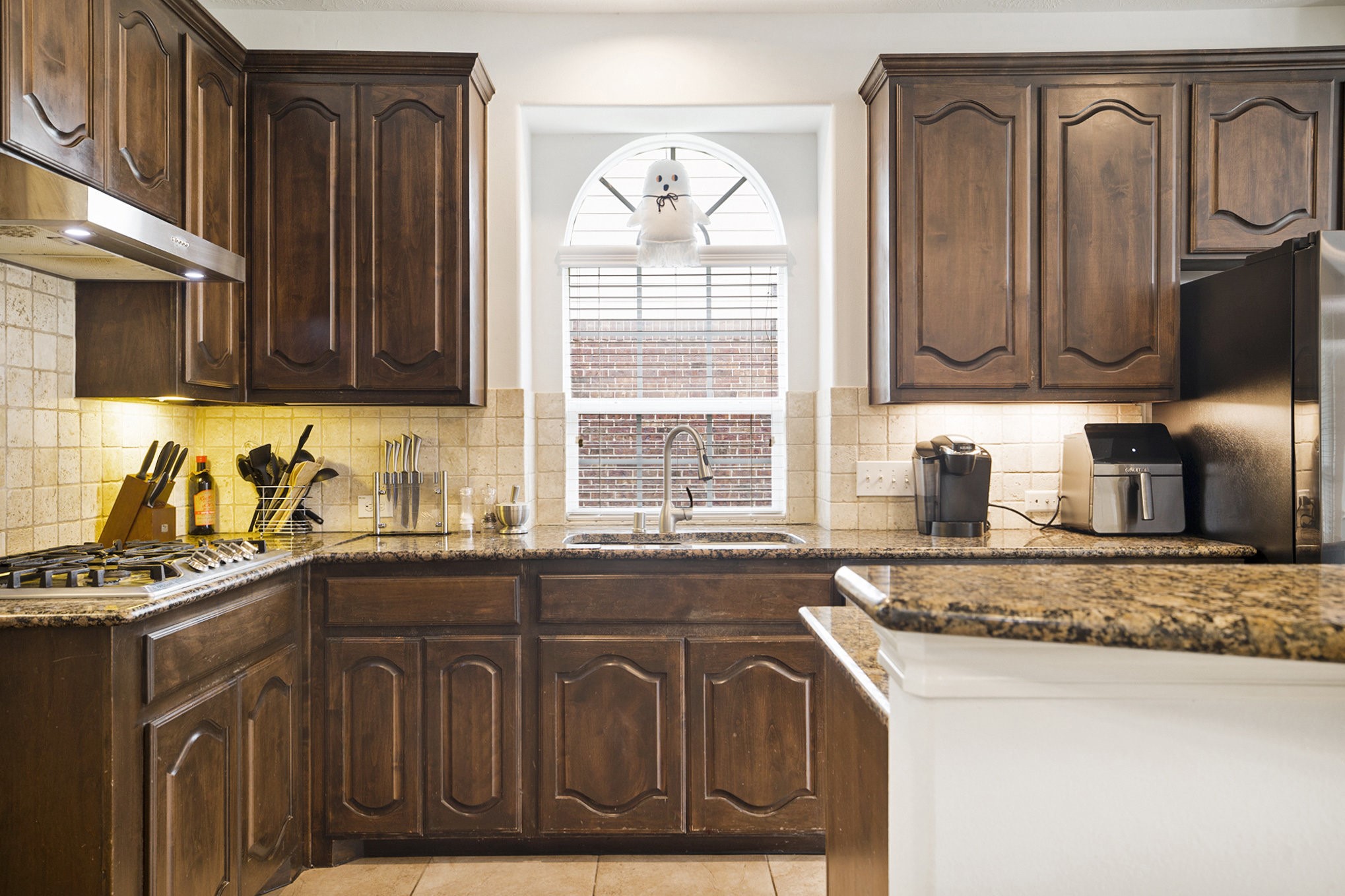 20692 Oakhurst Meadows Drive Porter, TX 77365 - Photo 10 of 37 a kitchen with stainless steel appliances granite countertop a sink stove and cabinets