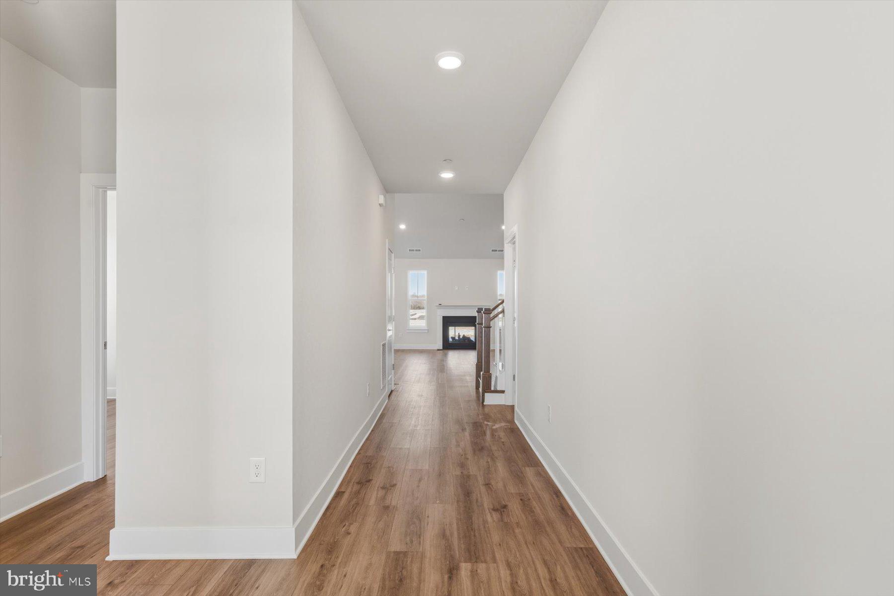 104 Sunbeam Way Milton, DE 19968 - Photo 2 of 56 a view of a hallway with wooden floor and a bathroom