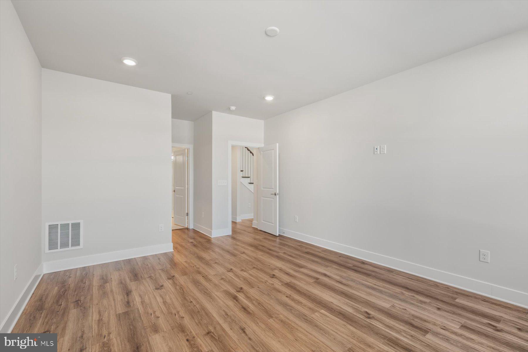 104 Sunbeam Way Milton, DE 19968 - Photo 29 of 56 a view of empty room with wooden floor and fan