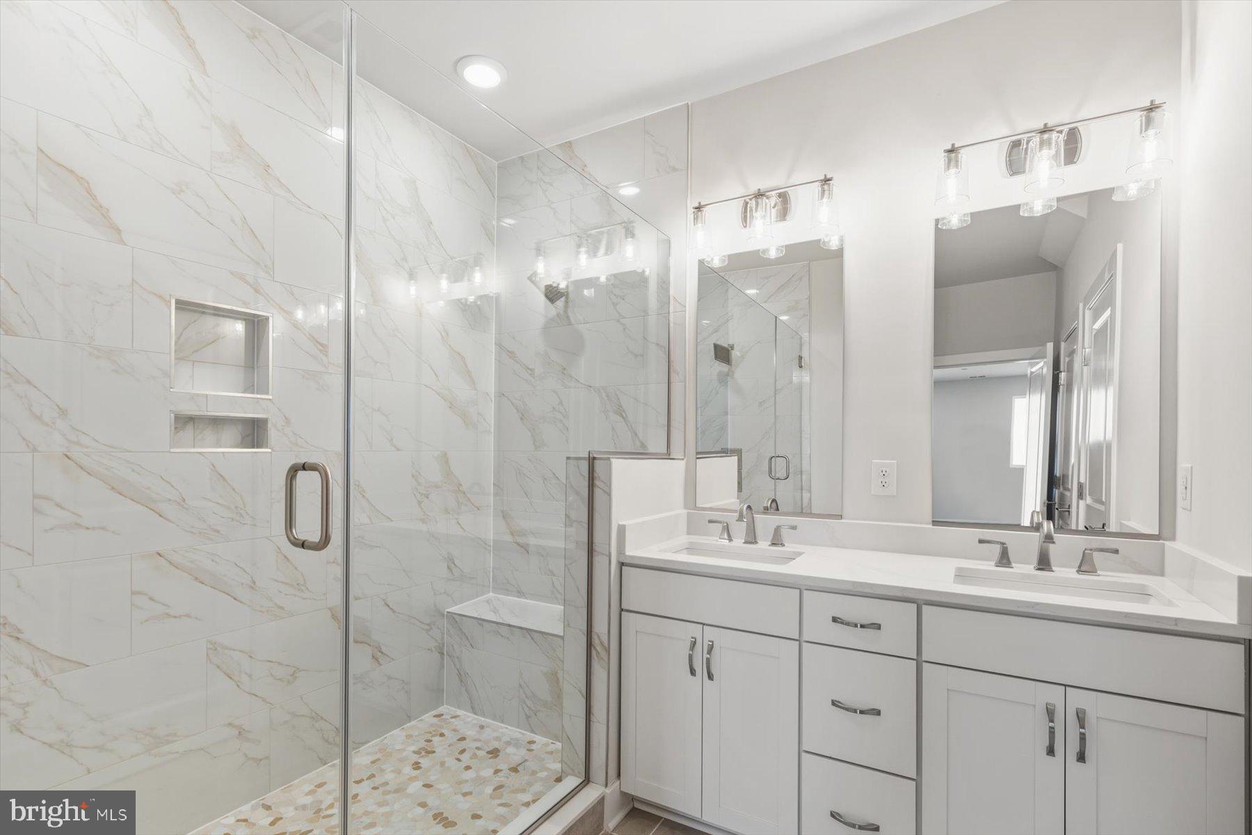 104 Sunbeam Way Milton, DE 19968 - Photo 31 of 56 a bathroom with a shower sink and mirror