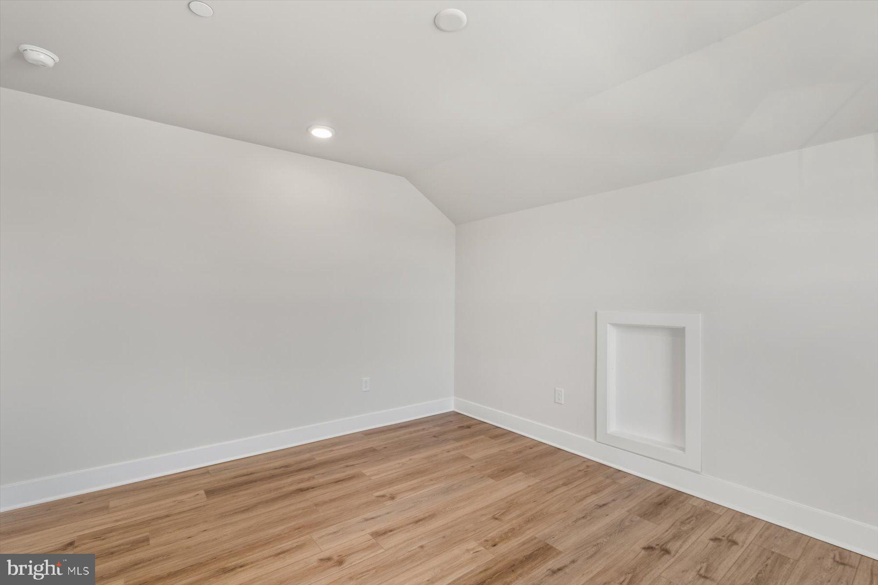 104 Sunbeam Way Milton, DE 19968 - Photo 36 of 56 a view of an empty room with wooden floor and closet