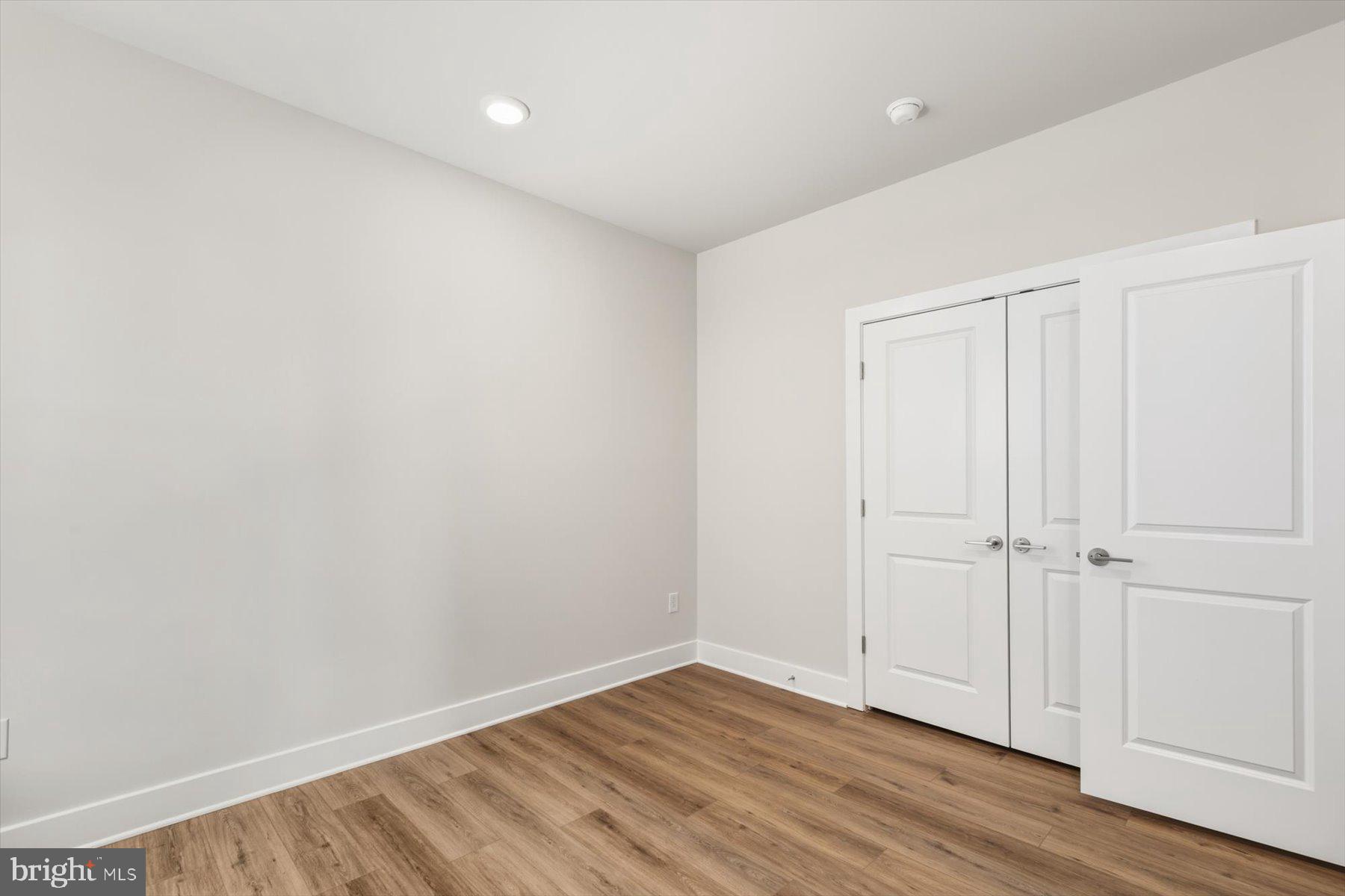 104 Sunbeam Way Milton, DE 19968 - Photo 42 of 56 a view of an empty room with wooden floor