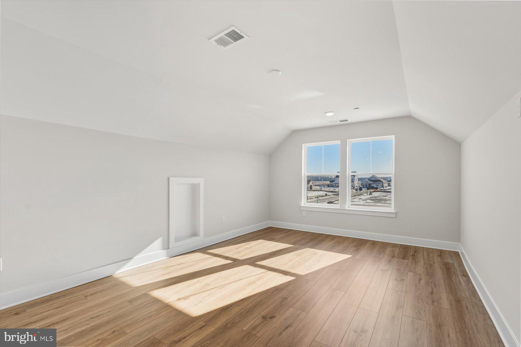104 Sunbeam Way Milton, DE 19968 - Photo 46 of 56 an empty room with wooden floor and windows