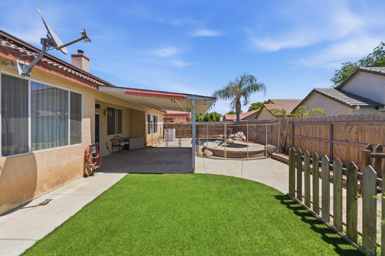 1757 Homestead Way Lemoore, CA 93245 - Photo 29 of 35 a view of a house with backyard and porch