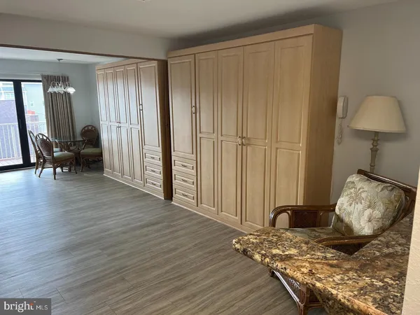 a view of a livingroom with furniture and wooden floor