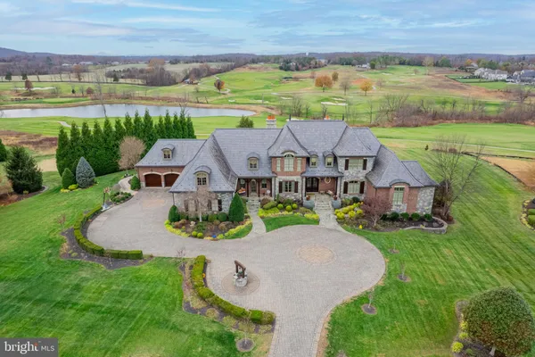 an aerial view of a house with outdoor space