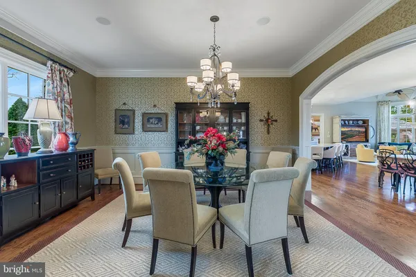 a kitchen with granite countertop a sink stove and cabinets