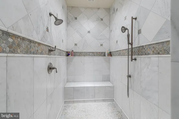 a building outdoor space with patio furniture and potted plants