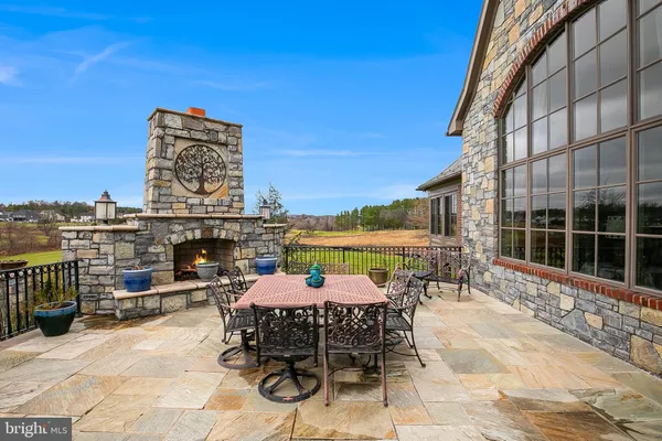 a view of living room and dining room with furniture wooden floor and a rug