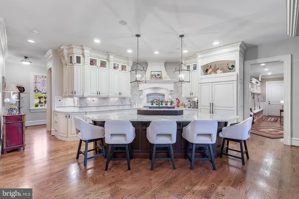 a living room with furniture fireplace and a large window