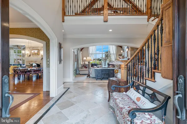 a view of a dining room with furniture and chandelier